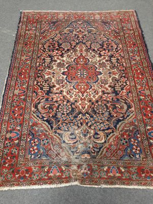 an antique persian rug is on the floor in a room