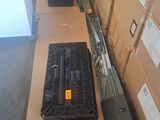 many boxes of tools sitting on a table in a warehouse