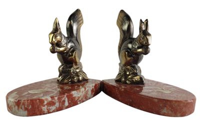 pair of antique bronze bookends of a rabbit and a bird on marble bases