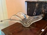 a glass bowl sitting on top of a wooden table