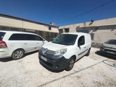 two vans parked in a parking lot next to each other
