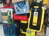 a pile of boxes and tools on a pallet in a warehouse