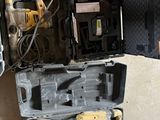 a tool box with tools on the floor next to other tools