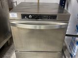 a dishwasher that is sitting in the middle of a room