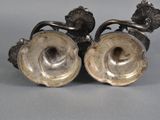 pair of silver plated candlestick holders with flowers and leaves