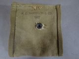 a close up of a bag with a button on it