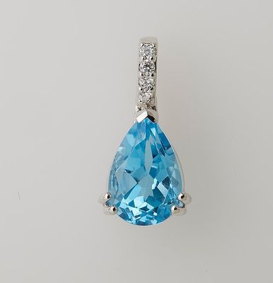 Pendentif en or blanc 750°/.(18K) 1g25 ornée d'une Topaze ta…