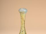 a glass vase that is sitting on a table