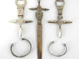 several different types of metal items are displayed on a white surface