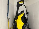 a yellow and black pressurer sitting on a shelf in a bathroom