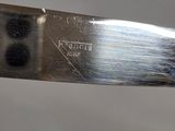 a close up of a knife that is on a table