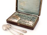 three spoons and two spoons in a case