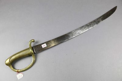 a knife that is sitting on a table with a tag on it