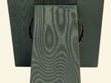 a picture of a green case with a brown handle