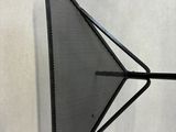 a close up of a metal object on a white surface