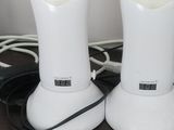 two white lights that are sitting on a table