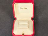 a small red box with a ring inside of it