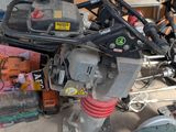 a picture of a pile of assorted tools in a garage