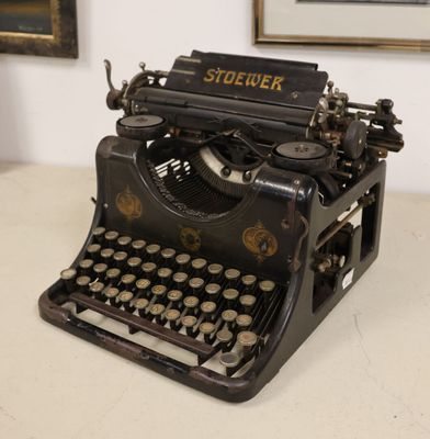 an old typewriter sitting on a table in a room