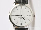 a black and white watch on a white surface