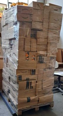 a large stack of boxes sitting on top of a pallet