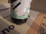 a bottle of beer sitting on top of a cardboard box