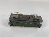 a toy train on a white surface with a white background
