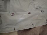 a close up of a jacket with buttons on it