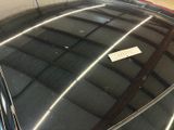 a sticker on the hood of a car that is parked