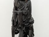 statue of a man with a hat on his head holding a cane