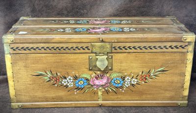 a wooden box with a floral design on it