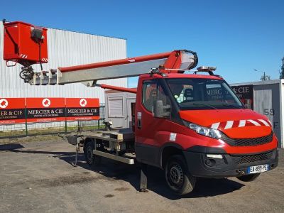 a red truck that is parked in front of a building