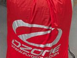 a red bag that is sitting on a shopping cart