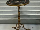 a small table that has a clock on top of it