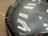 a close up of a car ' s hood with stickers on it