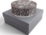 an image of a silver box with a decorative design on it