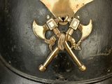 a helmet with two crossed axes on it