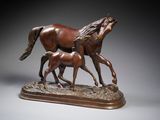statue of two horses and a foal on a wooden base