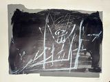 a black and white drawing on a piece of paper on the wall