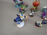 five figurines of different kinds of characters on a table