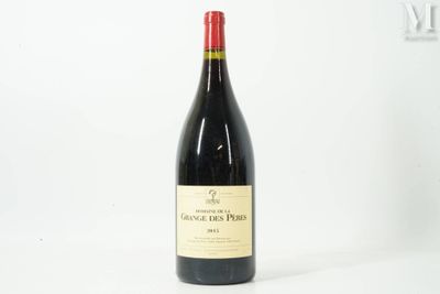 the bottle of wine is sitting on a white surface