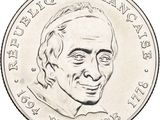 an old coin with a drawing of a man ' s face on it