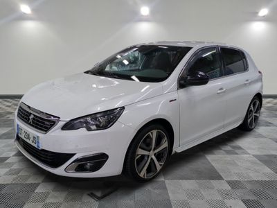 the white car is parked on a checkered floor in the garage
