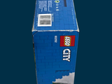 a blue box that has a lego city on it