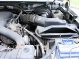 a picture of a car engine with its hood open
