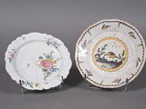 pair of porcelain plates with flowers and birds on them