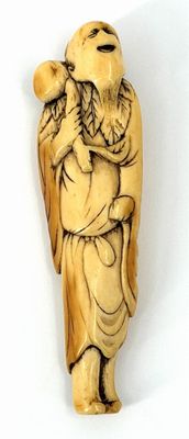carved ivory figurine of a man carrying a bag
