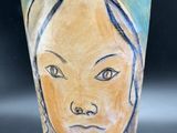a cup with a picture of a woman on it