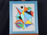 painting on easel with a blue frame and a black background