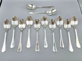 a lot of silver spoons and spoon spoons on a table